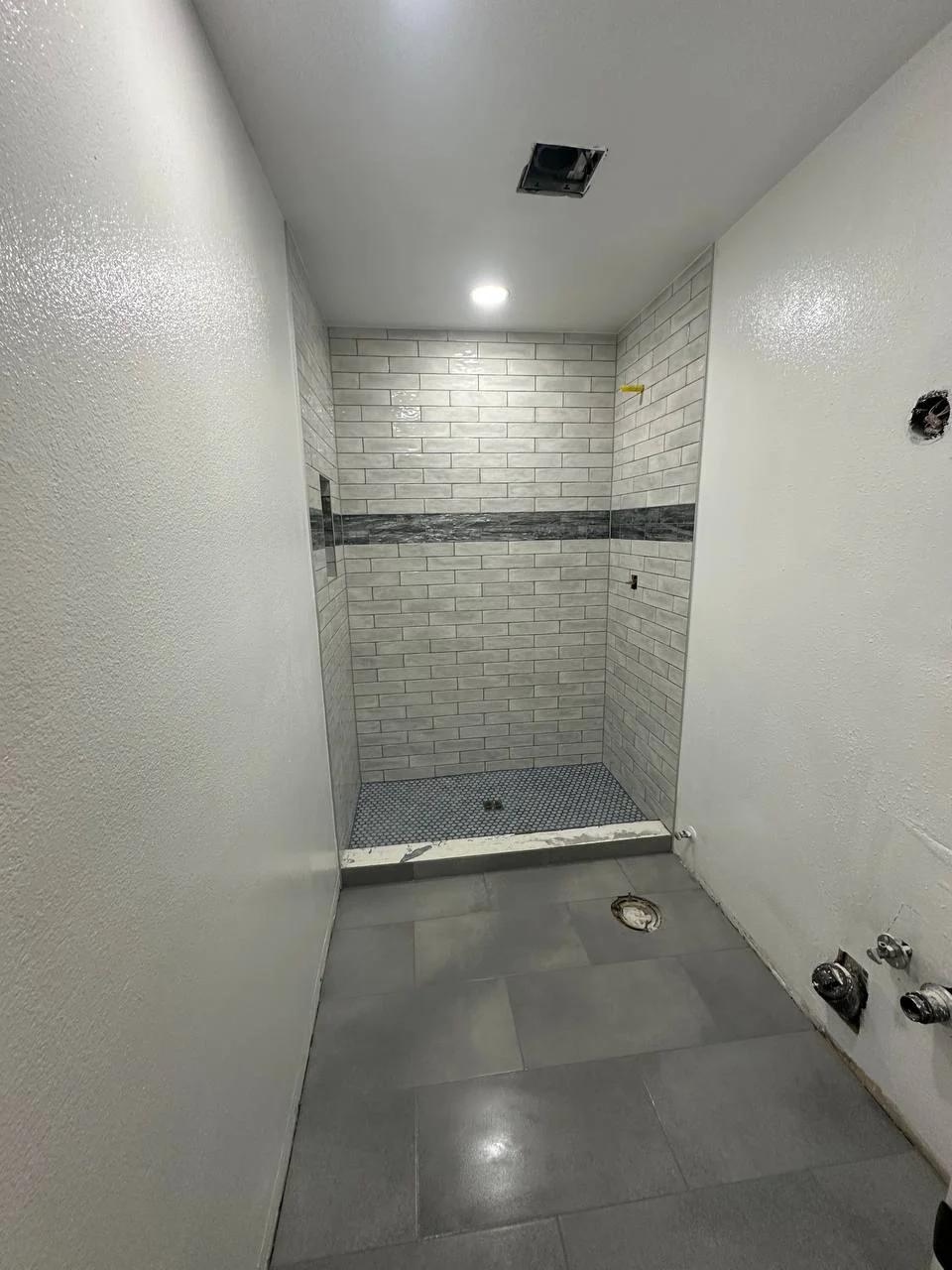 Subway Tile Shower with Mosaic Base